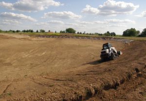 The pond begins to take shape.