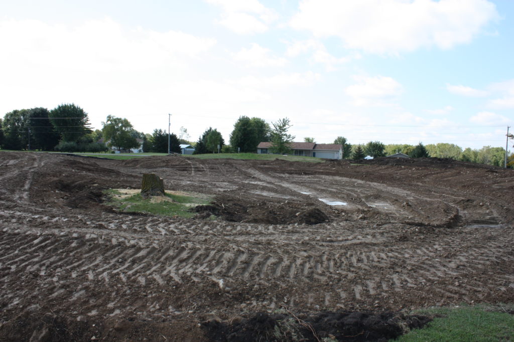 Backyard swim pond ground preparation and excavation