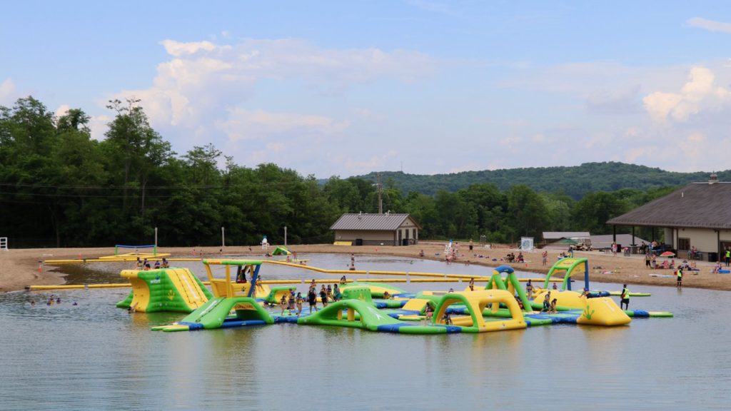 inflatables with people in pond