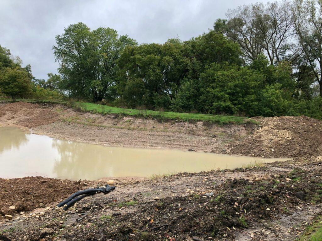 water in bare pond