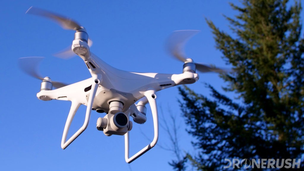 white drone in blue sky