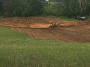 Excavator at Coloma pond