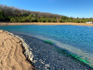 shoreline stone blanket and sand